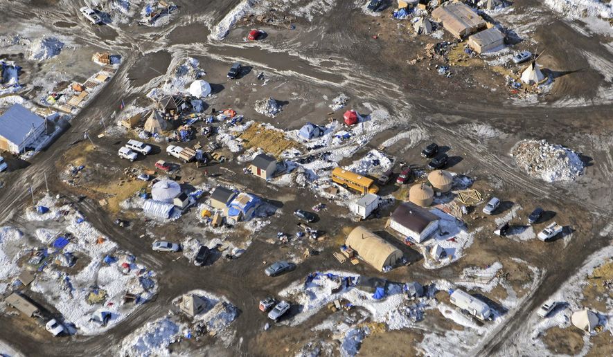 This aerial photo shows the Oceti Sakowin camp, where people have gathered to protest the Dakota Access pipeline on federal land, Monday, Feb. 13, 2017, in Cannon Ball, N.D. A federal judge on Monday refused to stop construction on the last stretch of the Dakota Access pipeline, which is progressing much faster than expected. (Tom Stromme/The Bismarck Tribune via AP)