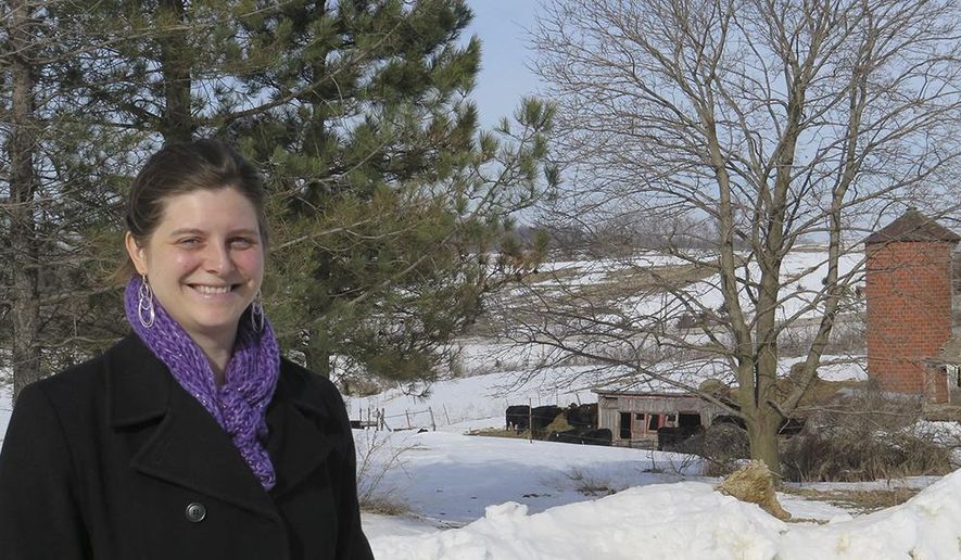 In this Friday, Feb. 10, 2017 photo, Jessica Hofschulte poses on the farm she runs with her husband, Chad near near Zumbro Falls in southeast Minnesota. Hofschulte says the state's farmer- lender mediation program saved her family's farm. (Catharine Richert/Minnesota Public Radio via AP)