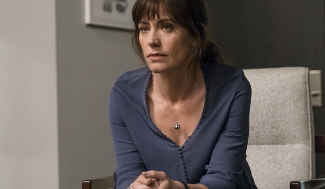 In this image released by Showtime, Maggie Siff portrays Wendy Rhoades in a scene from the series, &amp;quot;Billions,&amp;quot; airing Sundays at 10 p.m. EST on Showtime. ( Jeff Neumann/Showtime via AP)