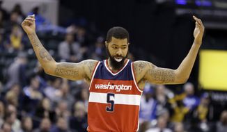 Washington Wizards forward Markieff Morris (5) celebrates in the final minute of the second half of an NBA basketball game against the Indiana Pacers in Indianapolis, Thursday, Feb. 16, 2017. (AP Photo/Michael Conroy) **FILE**