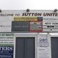 A sign advertising Sutton United&#39;s next fixture, which is against Arsenal on Monday 20th Feb, 2017 at Gander Green Lane, London, Thursday Feb. 16, 2017. Sutton United, the fifth-tier semiprofessional team will play Arsenal, the 13-time English champions, after reaching the fifth round of the FA Cup competition for the first time in its 118-year history on Monday Feb. 20, (Andrew Matthews/PA via AP)