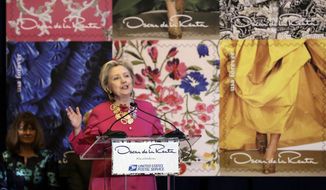 Hillary Clinton speaks during an unveiling postage stamps honoring the late fashion designer Oscar de la Renta in Grand Central Terminal, in New York, Thursday, Feb. 16, 2017. Clinton has praised Oscar de la Renta as an inspiration to striving immigrants like himself at an event honoring the late fashion designer with a series of commemorative stamps. (AP Photo/Richard Drew)