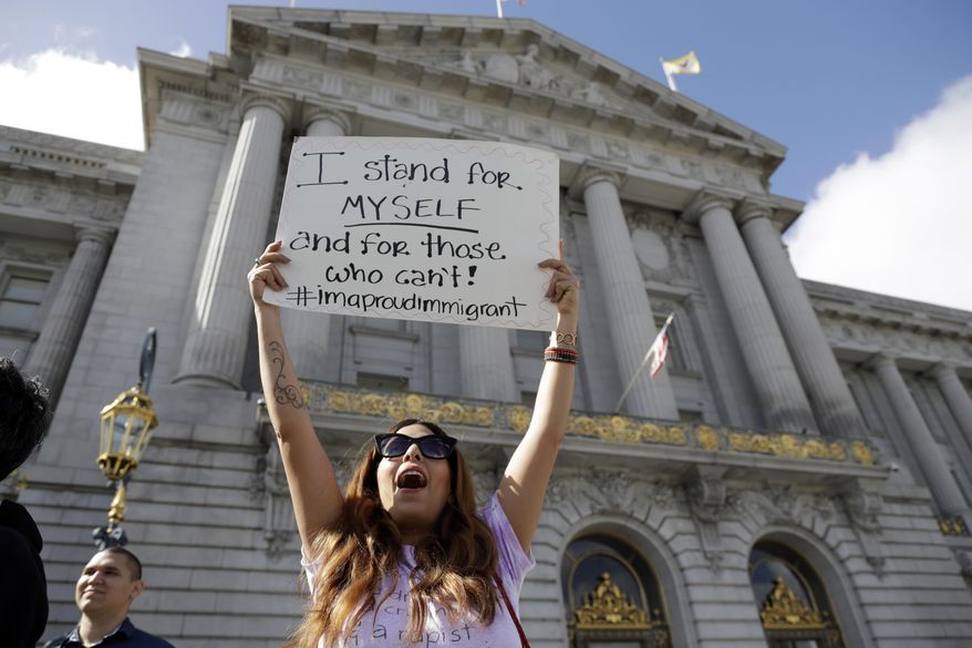 Elena Sanchez joins a protest against President Donald Trump's efforts to crack down on immigration Thursday, Feb. 16, 2017, in San Francisco. Immigrants around the country have been staying home from work and school today, hoping to demonstrate their importance to America's economy and its way of life. (AP Photo/Marcio Jose Sanchez)