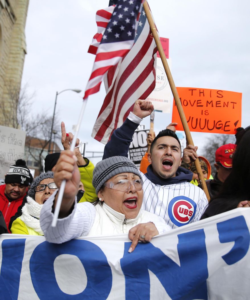 Protesters participate in a march aimed squarely at President Donald Trump's efforts to crack down on immigration Thursday, Feb. 16, 2017, in Chicago. Immigrants around the country have been staying home from work and school today, hoping to demonstrate their importance to America's economy and its way of life. (AP Photo/Charles Rex Arbogast)