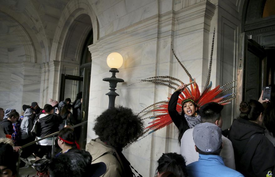 "A Day Without Immigrants," participants head inside the Minnesota State Capitol Thursday, Feb. 16, 2017, in St. Paul, Minn. Immigrants around the U.S. stayed home from work and school Thursday to demonstrate how important they are to America’s economy and way of life, and many businesses closed in solidarity, in a nationwide protest called A Day Without Immigrants. (David Joles/Star Tribune via AP)