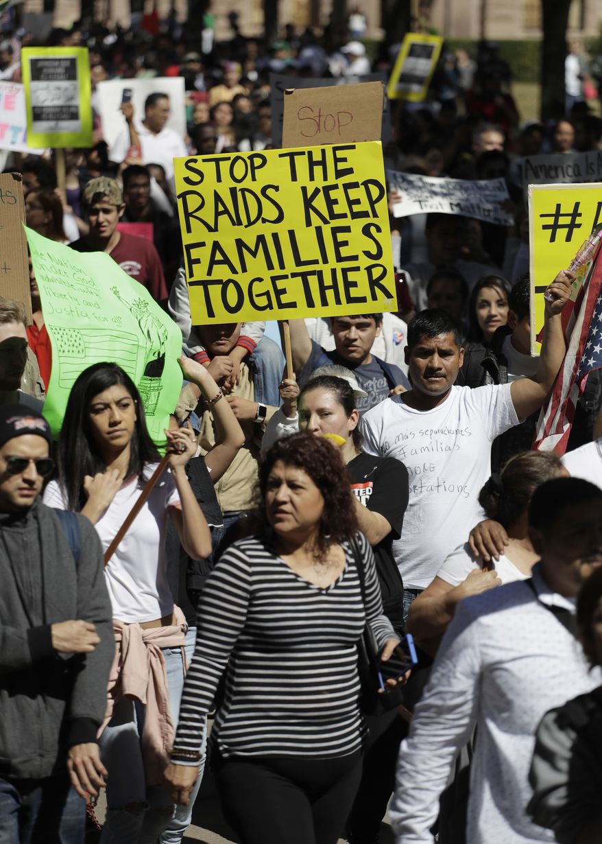 A group marches away from the Texas Capitol during an immigration protest, Thursday, Feb. 16, 2017, in Austin, Texas. Immigrants around the U.S. stayed home from work and school Thursday to demonstrate how important they are to America's economy and way of life, and many businesses closed in solidarity, in a nationwide protest called A Day Without Immigrants.(AP Photo/Eric Gay)