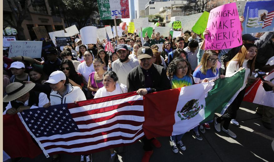 A group marches through downtown heading to the Texas Capitol during an immigration protest, Thursday, Feb. 16, 2017, in Austin, Texas. (AP Photo/Eric Gay)
