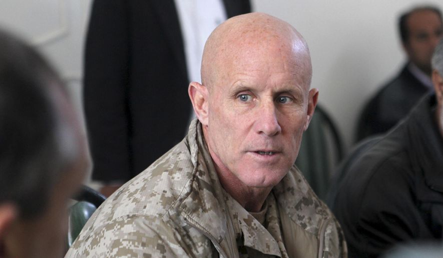 In this image provided by the U.S. Marine Corps, Vice Adm. Robert S. Harward, commanding officer of Combined Joint Interagency Task Force 435, speaks to an Afghan official during his visit to Zaranj, Afghanistan, Jan 6, 2011. Harward has turned down an offer to be President Donald Trump's new national security adviser, the latest blow to a new administration struggling to find its footing. A senior White House official said Feb. 16, 2017, that Harward had turned the offer down due to financial and family commitments. (Sgt. Shawn Coolman/U.S. Marine Corps via AP)