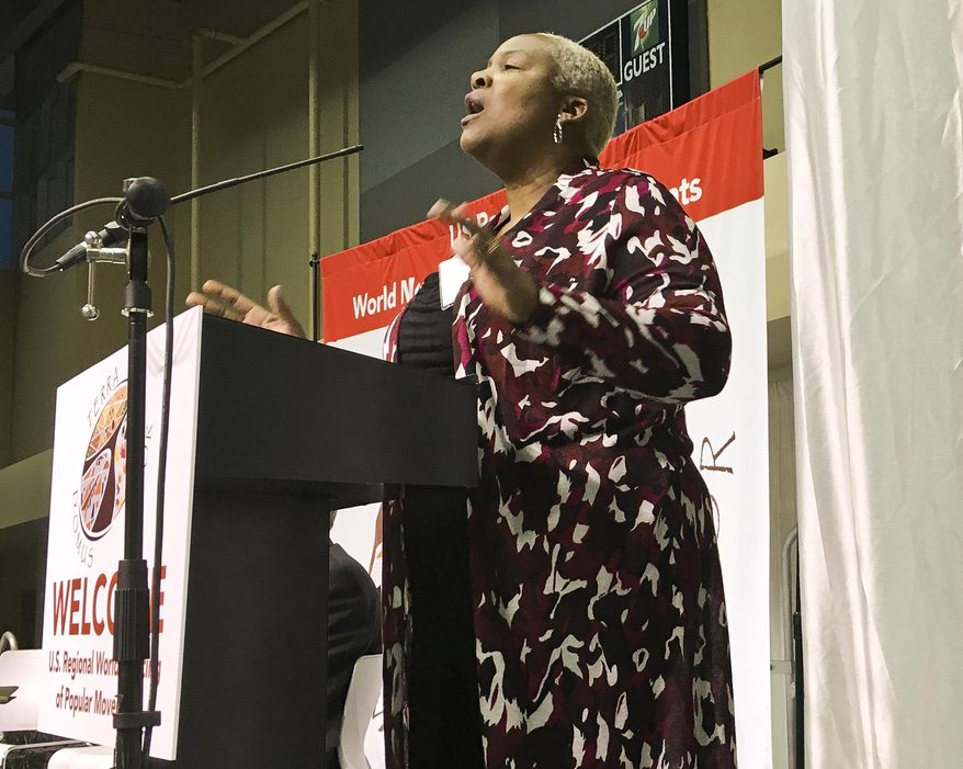 Trena Turner, pastor of the non-denominational Victory in Praise Church in Stockton, opens a four-day conference on economic inequality in Modesto, Calif., Thursday, Feb. 16, 2017. The Vatican is bringing its conversation on economic inequality to California's Central Valley. It comes at a time when the world is grappling with an America-first agenda and to a place where the economy is poor and relies on migrant labor. The four-day conference is an offshoot of global meetings launched by Pope Francis nearly three years ago to explore the "economy of exclusion." (AP Photo/Janie Har)