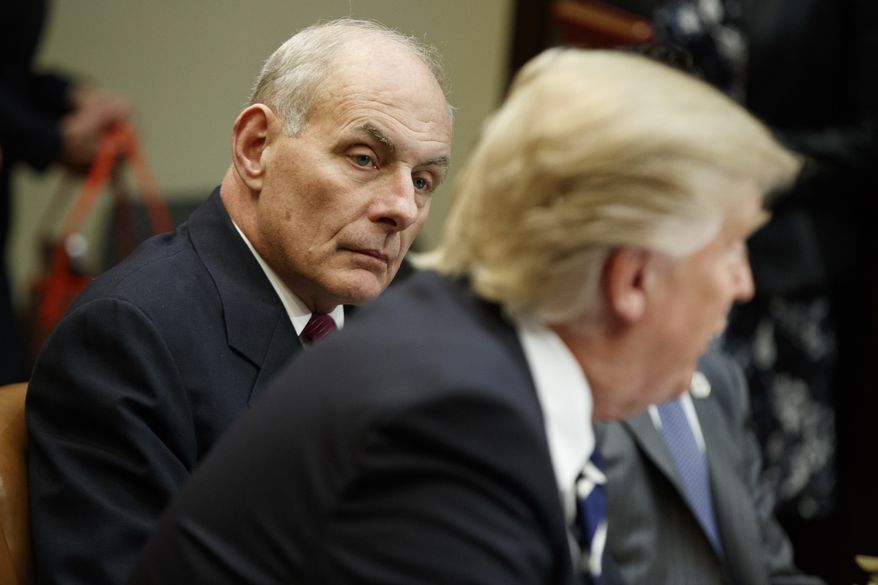 Homeland Security Secretary John Kelly (right) listens as President Donald Trump speaks during a meeting on cyber security in the Roosevelt Room of the White House in Washington on Jan. 31, 2017. (Associated Press) **FILE**
