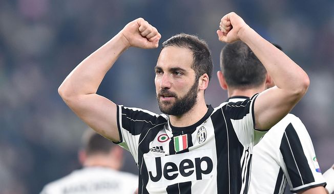 Juventus&#x27; Gonzalo Higuain celebrates after scoring during a Serie A soccer match Juventus and Palermo at the Juventus Stadium in Turin, Italy, Friday, Feb. 17 2017. (Alessandro di Marco/ANSA via AP)