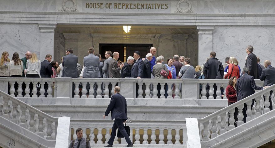 In this Thursday, Feb. 16, 2017, photo, lobbyists gather outside the Utah House of Representatives at the Utah State Capitol in Salt Lake City. Lobbyists who represent health care companies took a group of lawmakers who oversee health issues to dinner this week at an upscale restaurant in Salt Lake City. Lawmakers who attended all sit on committees that oversee health issues, but they say they were not lobbied health issues and it was a routine social event. (AP Photo/Rick Bowmer)