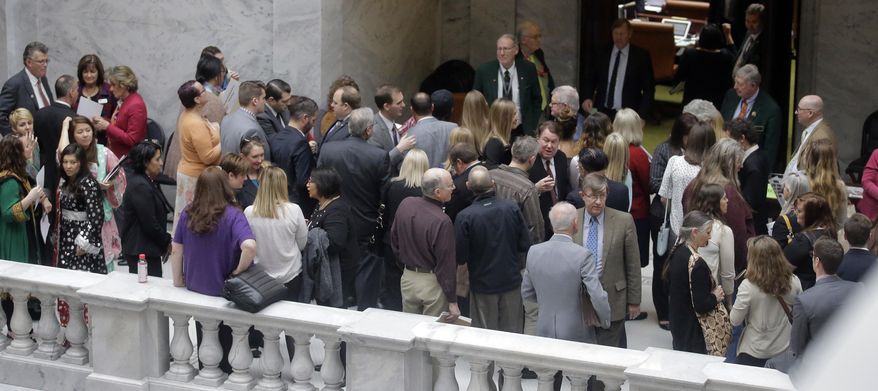 In this Thursday, Feb. 16, 2017, photo, lobbyists gather outside the Utah House of Representatives at the Utah State Capitol in Salt Lake City. Lobbyists who represent health care companies took a group of lawmakers who oversee health issues to dinner this week at an upscale restaurant in Salt Lake City. Lawmakers who attended all sit on committees that oversee health issues, but they say they were not lobbied health issues and it was a routine social event. (AP Photo/Rick Bowmer)