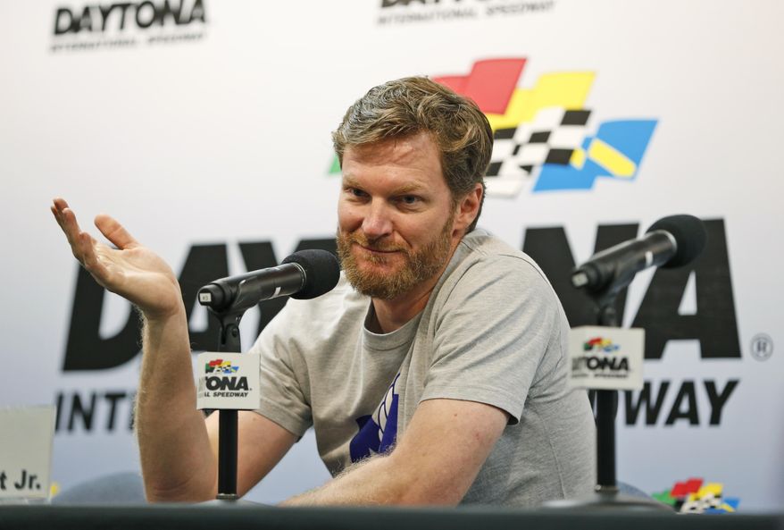 FILE - In this June 30, 2016, file photo, Dale Earnhardt Jr. gestures as he speaks during a news conference before the start of a NASCAR Sprint Cup auto racing practice at Daytona International Speedway, in Daytona Beach, Fla. NASCAR has a new sponsor, a new format and a familiar face this year in its bid to rebound from declining ratings and attendance. The next 11 months will show if Dale Earnhardt Jr., Monster Energy and different rules can provide the needed jolt.(AP Photo/Wilfredo Lee, File)
