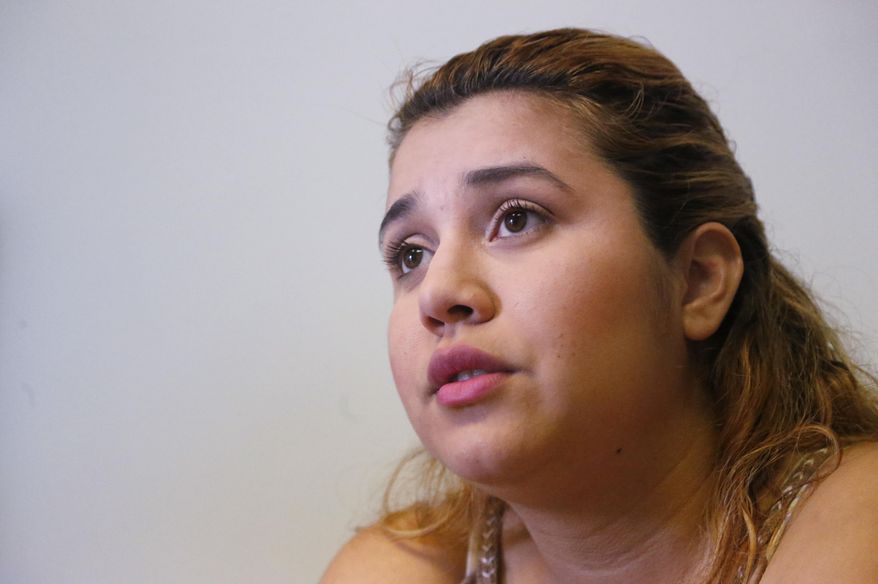 In this, Monday, Feb. 13, 2017, photo, Itzel Munoz, 23, who was brought to the U.S. as a child from Mexico, speaks during an interview with The Associated Press in Homestead, Fla. A county with an immigrant leader where most people were born abroad has bucked the trend of the sanctuary city movement, creating fear among the undocumented and exposing a long-standing disconnect between Cuban-Americans and the rest of the Latinos. Miami-Dade's Cuban-born Mayor Carlos Gimenez went against other immigrant-rich cities in ordering its officials to abide by President Donald Trump's immigration orders. (AP Photo/Wilfredo Lee)