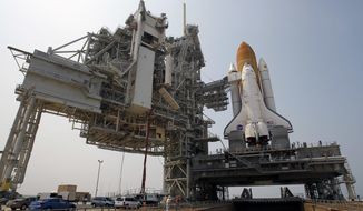 n this Friday, June 17, 2011, file photo, space shuttle Atlantis is mounted on Pad 39A at the Kennedy Space Center in Cape Canaveral, Fla. (AP Photo/John Raoux) ** FILE **