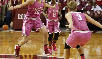 Oklahoma&#39;s Peyton Little (10) and Derica Wyatt (3) celebrate as time expires  in their 74-73 win over No. 8 Texas in an NCAA college basketball at The Lloyd Noble Center, Saturday, Feb. 18, 2017 in Norman, Okla. (Steve Sisney/The Oklahoman via AP)