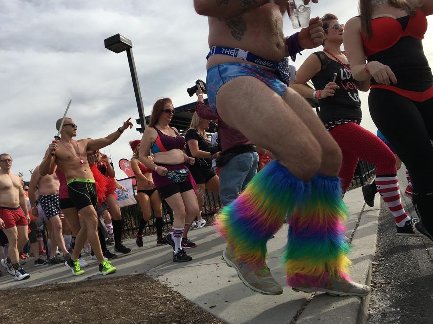 Joggers wearing in boxers, briefs, bras, bloomers and other underwear take off at the start of Cupid's Undie Run for charity in Philadelphia on Saturday, Feb. 18. 2017. (AP Photo/Dino Hazel)