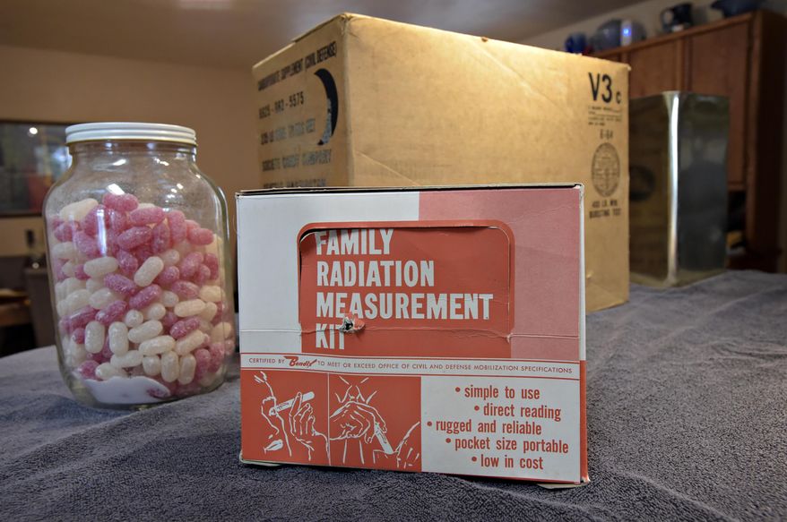 ADVANCE FOR WEEKEND EDITIONS, FEB. 18-19 - In this Jan. 25, 2017 photo, Ron "Yogi" Blodgett displays survival items at his Corvallis, Ore., home. Candy, a box of food and a radiation measurement kit, were a part of the supplies Col. James Blodgett, his father, who was charged with collecting and distributing in his role as Civil Defense coordinator for Benton County. (Andy Cripe/The Corvallis Gazette-Times via AP)