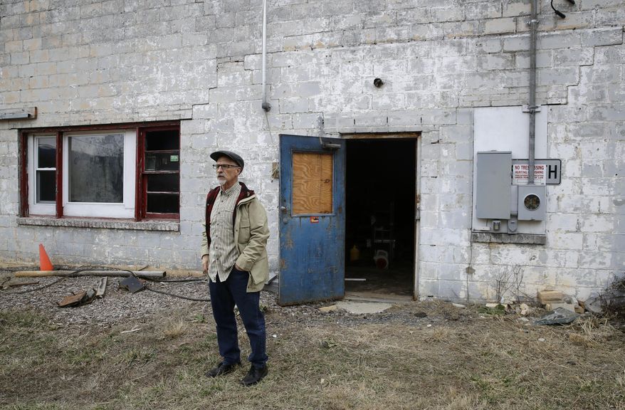 In this Feb. 8, 2017 photo, author Ed Maliskas stands outside a dilapidated dance hall in Dargan, Md., that hosted dozens of black performers including James Brown, Ray Charles, Etta James and Otis Redding during the racially segregated 1950s and early '60s. The structure stands on the same property as the house where abolitionist John Brown launched his 1859 seizure of a federal armory in nearby Harpers Ferry, W.Va. "I think it should be considered the No. 1 black history site in the United States," said Maliskas. author of a self-published volume about the property. (AP Photo/Patrick Semansky)