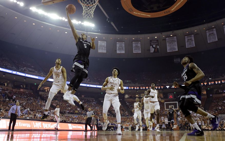Kansas State guard Barry Brown (5) scores against Texas during the first half of an NCAA college basketball game, Saturday, Feb. 18, 2017, in Austin, Texas. (AP Photo/Eric Gay)