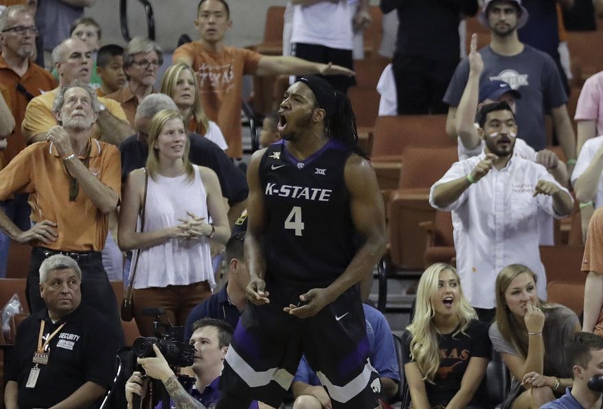 Kansas State forward D.J. Johnson (4) celebrates with teammates after he hit the winning shot in the final seconds of the second half of an NCAA college basketball game against Texas, Saturday, Feb. 18, 2017, in Austin, Texas. Kansas State won 64-61. (AP Photo/Eric Gay)