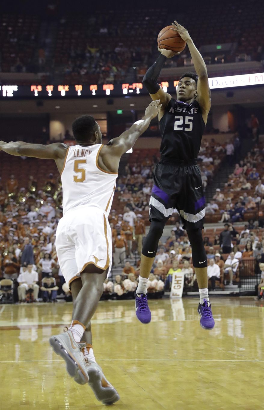 Kansas State forward Wesley Iwundu (25) shoots over Texas guard Kendal Yancy (5) during the first half of an NCAA college basketball game, Saturday, Feb. 18, 2017, in Austin, Texas. (AP Photo/Eric Gay)