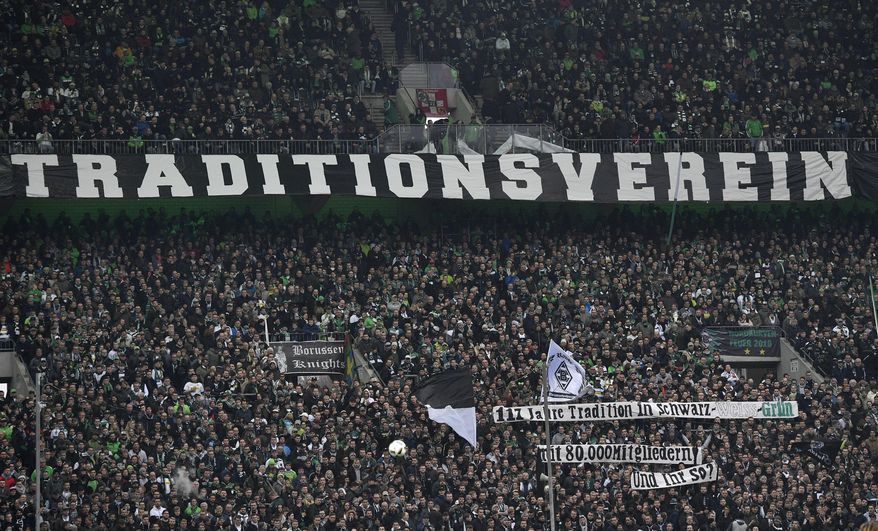 Borussia supporters show a banner reading 'tradition club' to protest against newcomer RB Leipzig during the German Bundesliga soccer match between Borussia Moenchengladbach and RB Leipzig in Moenchengladbach, Sunday, Feb. 19, 2017. (AP Photo/Martin Meissner)