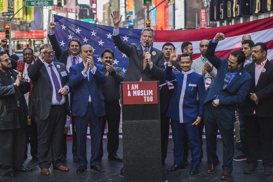 New York City Mayor Bill de Blasio speaks during a rally in support of Muslim Americans and protest of President Donald Trump's immigration policies in Times Square, New York, Sunday, Feb. 19, 2017. (AP Photo/Andres Kudacki)
