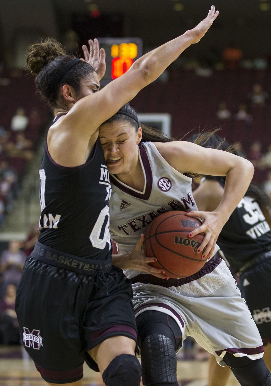 Texas A&M guard Danni Williams (12) tries to drive the lane against Mississippi State guard Dominique Dillingham (00) during the first half of an NCAA college basketball game, Sunday, Feb. 19, 2017, in College Station, Texas. (AP Photo/Sam Craft)