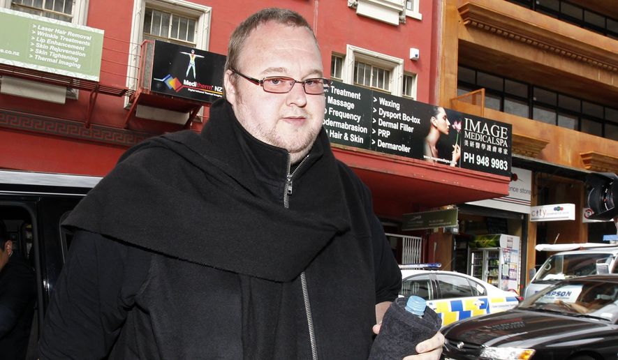 FILE - In this Nov. 27, 2014, file photo, Kim Dotcom arrives at Auckland District Court in Auckland, New Zealand. A New Zealand judge on Monday, Feb. 20, 2017, upheld an earlier court ruling that flamboyant internet entrepreneur Kim Dotcom and three of his colleagues can be extradited to the U.S. to face criminal charges. The decision comes five years after U.S. authorities shut down Dotcom&#39;s file-sharing website Megaupload and filed charges of conspiracy, racketeering and money laundering against the men. (Chris Gorman/New Zealand Herald via AP, File)