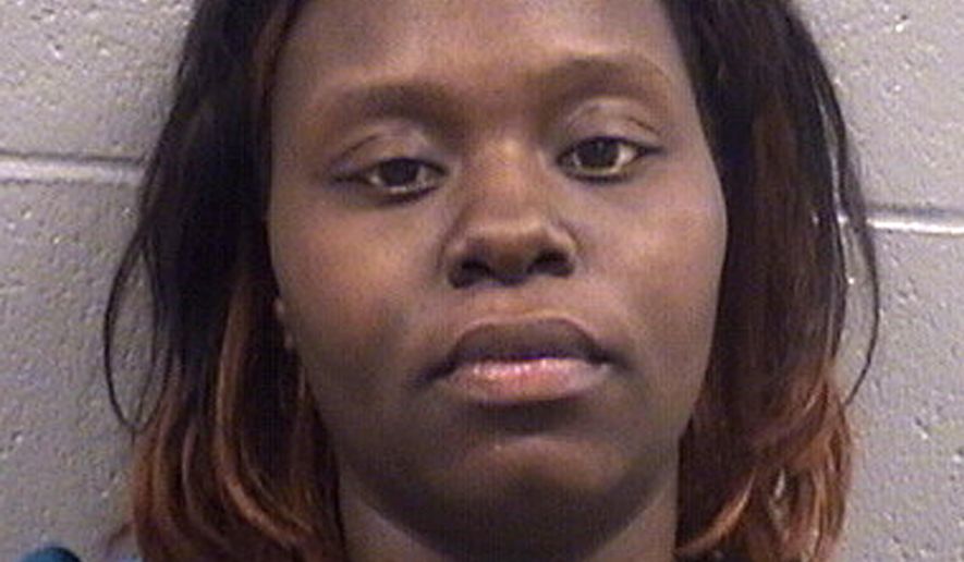 This undated photo provided by the Cook County Sheriff's Department shows Shawnquail Minnis. Authorities say Minnis faces a first-degree murder charge accusing her of starving her 2-month-old son to death in 2014. Court records show that Minnis' baby became so emaciated that medical workers could see facial bones and ribs through his skin. (Cook County Sheriff's Department via AP)