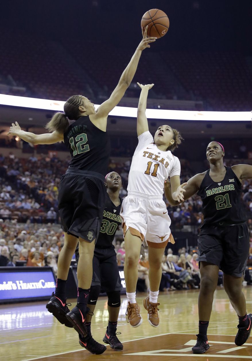 Texas guard Brooke McCarty (11) is blocked by Baylor guard Alexis Prince (12) as she tries to score during the first half of an NCAA college basketball game, Monday, Feb. 20, 2017, in Austin, Texas. (AP Photo/Eric Gay)