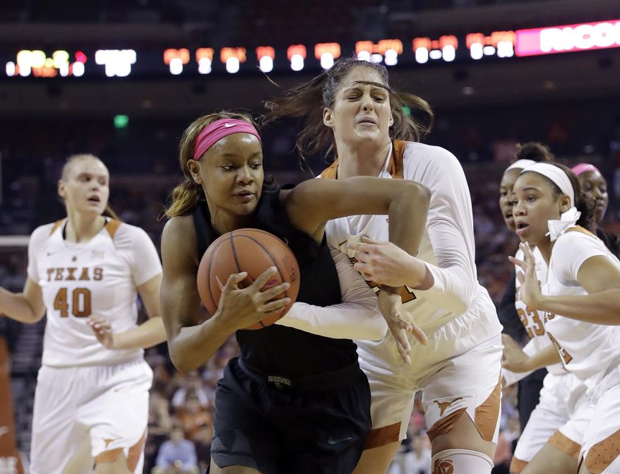 Baylor forward Nina Davis, left, and Texas forward Audrey-Ann Caron-Goudreau, right, battle for control of the ball during the first half of an NCAA college basketball game, Monday, Feb. 20, 2017, in Austin, Texas. (AP Photo/Eric Gay)