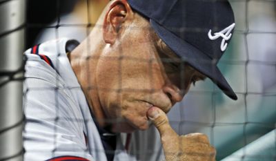 FILE - In this Aug. 12, 2016, file photo, Atlanta Braves interim manager Brian Snitker looks at his notes during a baseball game against the Washington Nationals at Nationals Park in Washington. With his career in baseball approaching four decades long, he figured there wasn&#39;t much chance of actually getting the call to the big leagues. But here he is _ finally, at the age of 61 _ getting ready for his first full season as manager of the Atlanta Braves. (AP Photo/Alex Brandon, File)