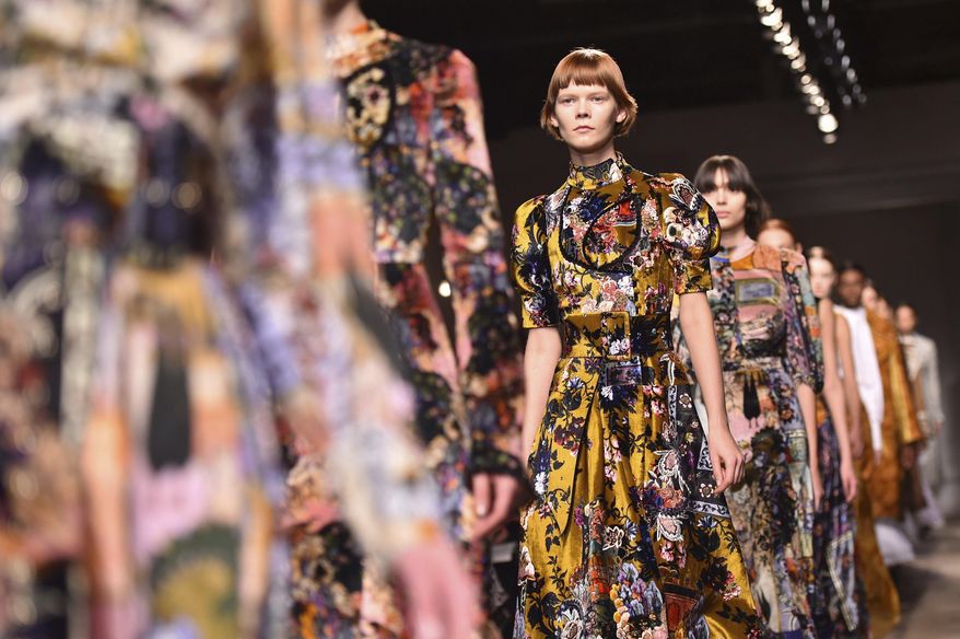 Models wear a creations during the Erdem Autumn/Winter 2017 London Fashion Week show in London Monday Feb. 20, 2017. (Matt Crossick/PA via AP)