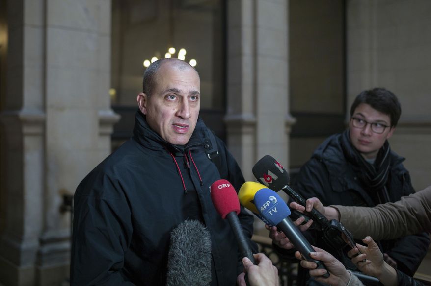 Chief suspect Vjeran Tomic faces the media at court for his trial in Paris, Monday Feb. 20, 2017, accused of involvement in one of the world's biggest art heists. Three people, including Vieran are accused of being involved in a dramatic 2010 theft of more than $100 million worth of artworks from the Paris Museum of Modern Art, including a Picasso, a Matisse and other masterpieces. (AP Photo/Thibault Camus)