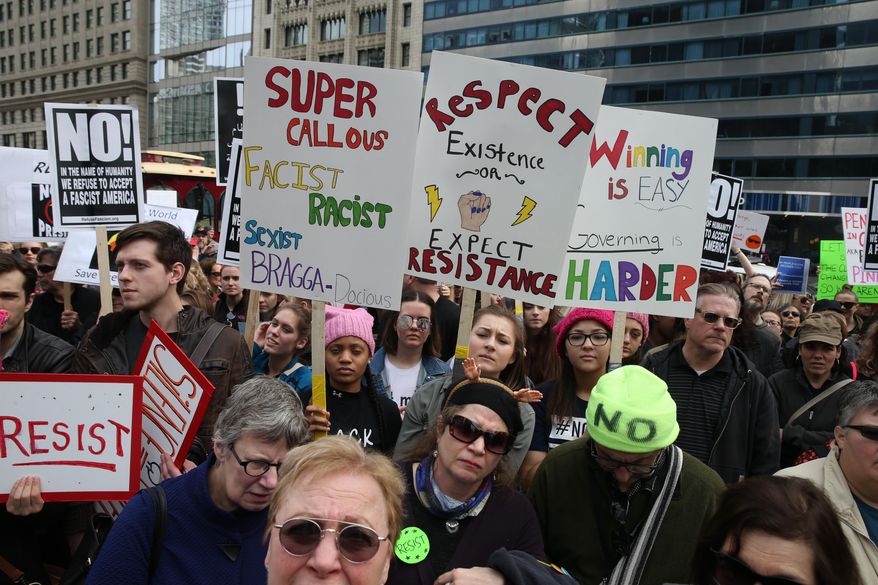 Protesters demonstrate near the Trump Tower in Chicago on Presidents Day, Monday, Feb. 20, 1017. (Terrence Antonio James/Chicago Tribune via AP)