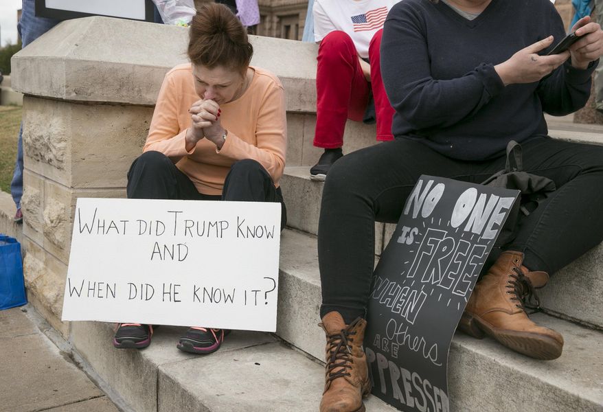 Carolyn Chavana cries while listening to speakers at the Not My President rally at the Capitol in Austin, Texas, Monday, Feb. 20, 2017. Protesters rallied against President Donald Trump on Presidents Day. (Jay Janner/Austin American-Statesman via AP)