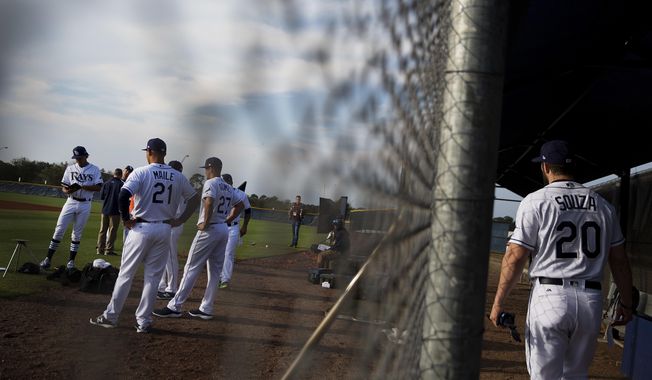 Tampa Bay Rays&#x27; Steven Souza Jr., right, joins teammates on the field waiting to have their picture taken during the team&#x27;s photo day at baseball spring training in Port Charlotte, Fla., Saturday, Feb. 18, 2017. (AP Photo/David Goldman)