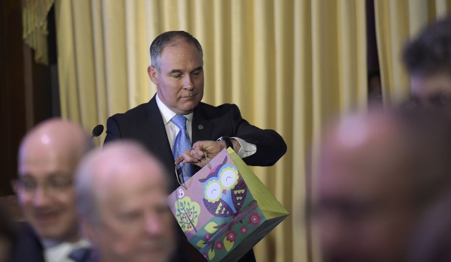 Environmental Protection Agency (EPA) Administrator Scott Pruitt looks at his watch after speaking to employees of the EPA in Washington, Tuesday, Feb. 21, 2017. (AP Photo/Susan Walsh)