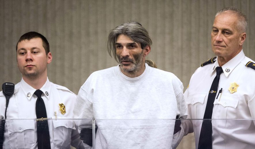 Michael Hebb is arraigned on two counts of first degree murder at Peabody District Court on Tuesday, Feb. 21, 2017, in Peabody, Mass. Hebb, a suspect in a grisly double homicide, was held without bail on Tuesday as authorities continued to search for an accomplice. (Scott Eisen/Daily Item of Lynn, Pool)
