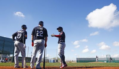 Cleveland Indians&#39; Michael Brantley (23), Jason Kipnis (22) and Francisco Lindor, right, all talk prior to batting at the team&#39;s baseball spring training facility Monday, Feb. 20, 2017, in Goodyear, Ariz. (AP Photo/Ross D. Franklin)