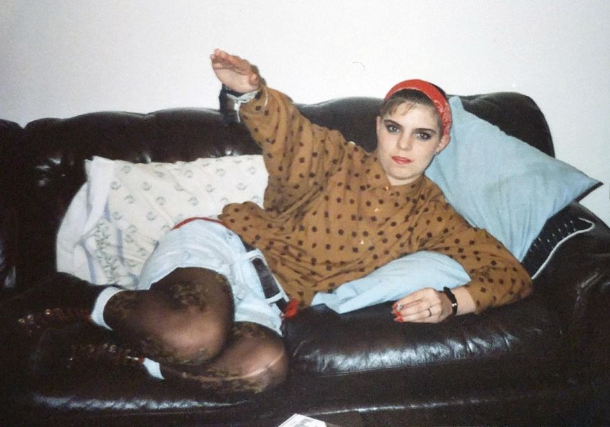 This undated photo provided by Christian Picciolini shows Shannon Martinez giving a Nazi salute while she was part of a racist skinhead organization as a teen decades ago. Martinez, now affiliated with Life After Hate, a nonprofit that works to get people out of extremist groups, talks to people in an online forum sponsored by the organization. (Christian Picciolini via AP)