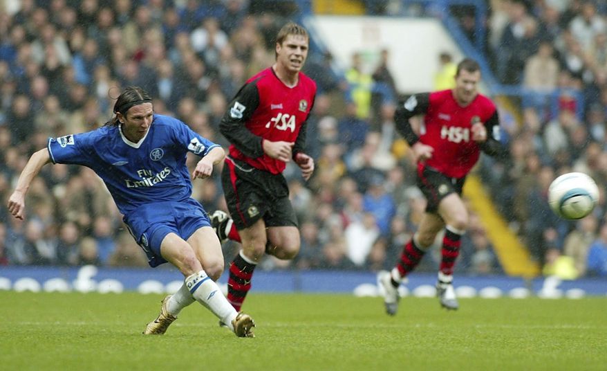 FILE In this Saturday Oct. 23, 2004 file photo Chelsea's Alexei Smertin, left, in action during the English Premiership League soccer match against Blackburn Rovers at Stamford Bridge, Chelsea, London. Former Chelsea midfielder Alexei Smertin has been put in charge of investigating soccer racism in Russia. (AP Photo/John D McHugh, File)