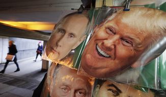 In this Monday, Feb. 20, 2017 photo face masks depicting Russian President Vladimir Putin and US President Donald Trump hang on sale at a souvenir street shop in St.Petersburg, Russia. The Kremlin refrained from comment Tuesday, Feb. 21, 2017 on the appointment of the new U.S. national security adviser Army Lt. Gen. H.R. McMaster, but one lawmaker said he was likely to take a hawkish stance toward Russia. (AP Photo/Dmitri Lovetsky)