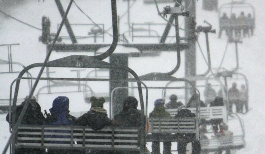 FILE -- In this Dec. 3, 2007 file photo, skiers fill the lifts at Stowe Mountain Resort in Stowe, Vt. The Colorado-based Vail Resorts announced Tuesday, Feb. 21, 2017, that it is purchasing the Vermont resort for $50 million. If the deal goes through, it would be Vail's first East Coast resort. Vail owns 10 mountain resorts and three urban ski areas. (AP Photo/Toby Talbot, File)