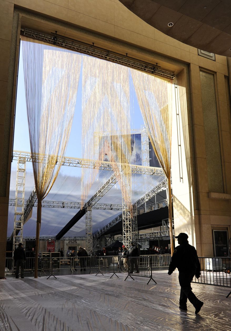 A gold curtain hangs down from the entrance to the Dolby Theatre in preparation for Sunday's 89th Academy Awards, on Wednesday, Feb. 22, 2017, in Los Angeles. (Photo by Chris Pizzello/Invision/AP)
