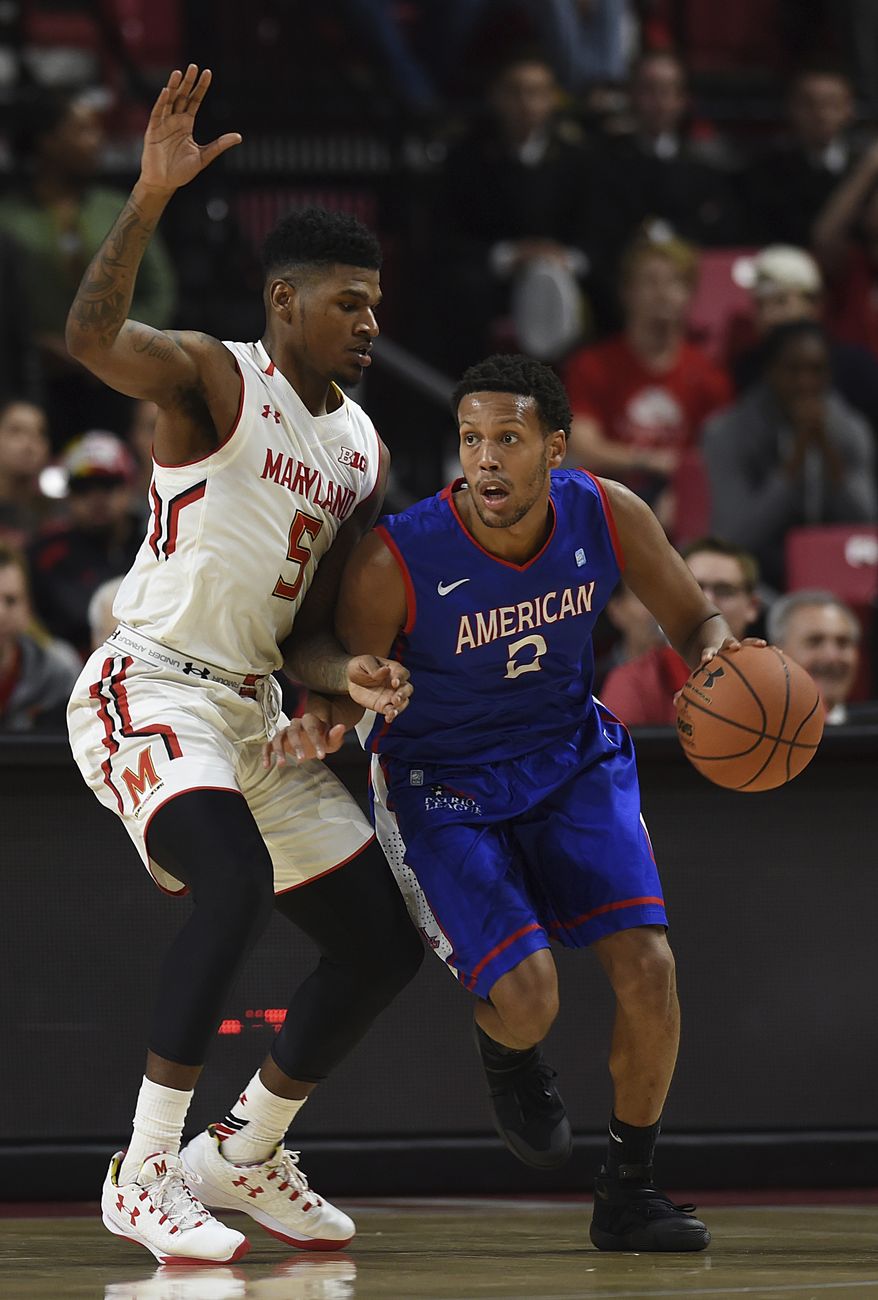 Maryland's Melo Trimble, left, reaches for a steal as American's Saeed Nelson dribbles during the second half of an NCAA college basketball game, Nov. 11, 2016 in College Park, Md. (AP Photo/Gail Burton) **FILE**