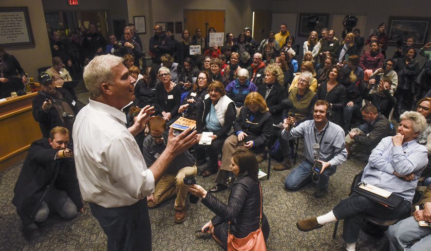 U.S. Rep. Tom Emmer answers a question near the end of a town hall meeting in Sartell, Minn., Wednesday, Feb. 22, 2017. Emmer&#39;s town hall went on as planned after the congressman said he would shut down the event if protests or unruly attendees disrupted the conversation. (Dave Schwarz/St. Cloud Times via AP)